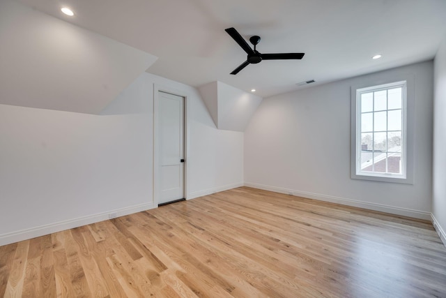 bonus room featuring ceiling fan, vaulted ceiling, and light hardwood / wood-style flooring