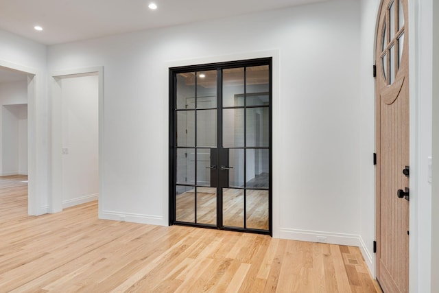 unfurnished room with light hardwood / wood-style flooring