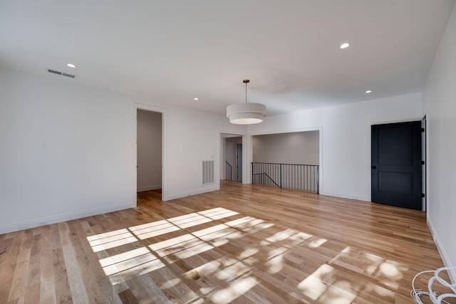 unfurnished room with light hardwood / wood-style floors