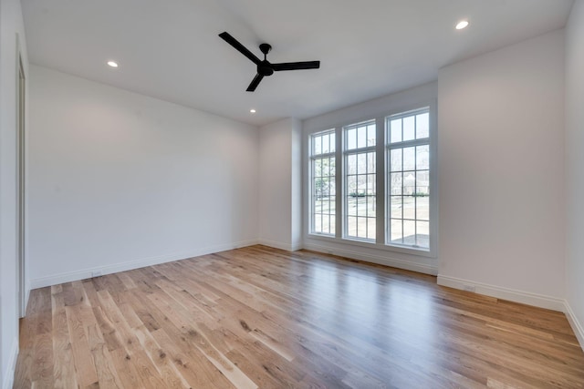 unfurnished room featuring ceiling fan and light wood-type flooring