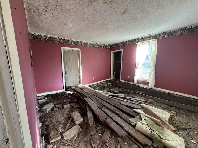 interior space featuring a textured ceiling