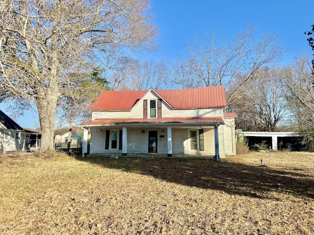 view of front of home featuring covered porch and a front yard