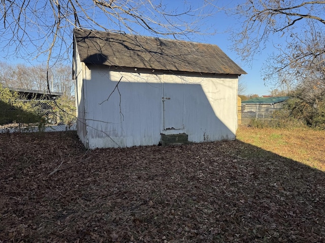 view of home's exterior with a storage shed