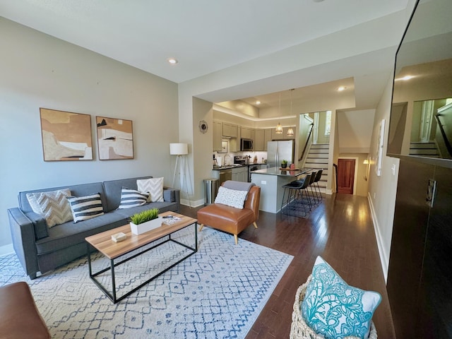 living room with dark hardwood / wood-style floors