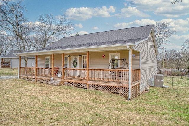 view of front of house with cooling unit, a front lawn, and a porch