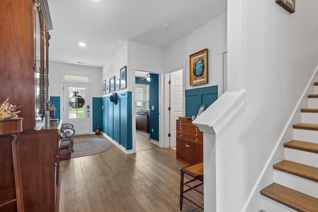 entryway with hardwood / wood-style flooring and ceiling fan