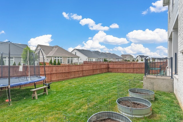 view of yard with a trampoline