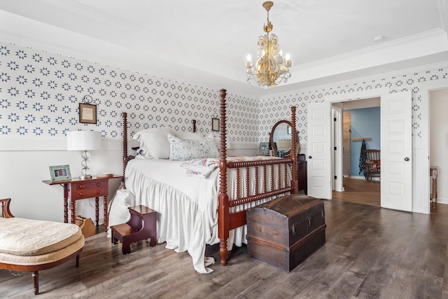 bedroom featuring ornamental molding, dark wood-type flooring, and a notable chandelier