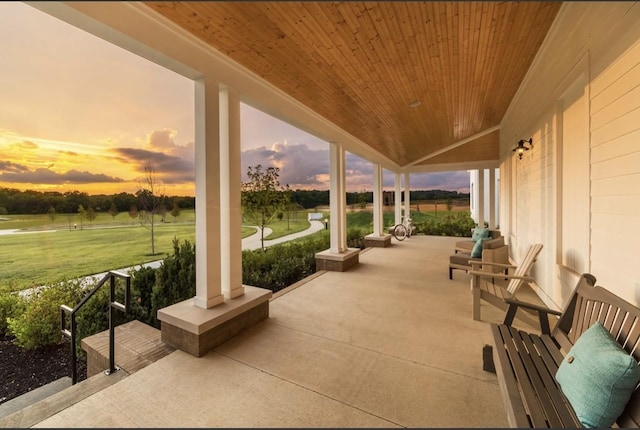 patio terrace at dusk with covered porch