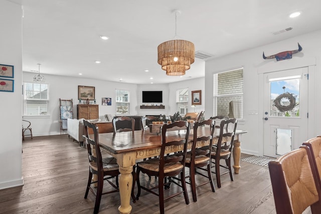 dining room with dark wood-type flooring