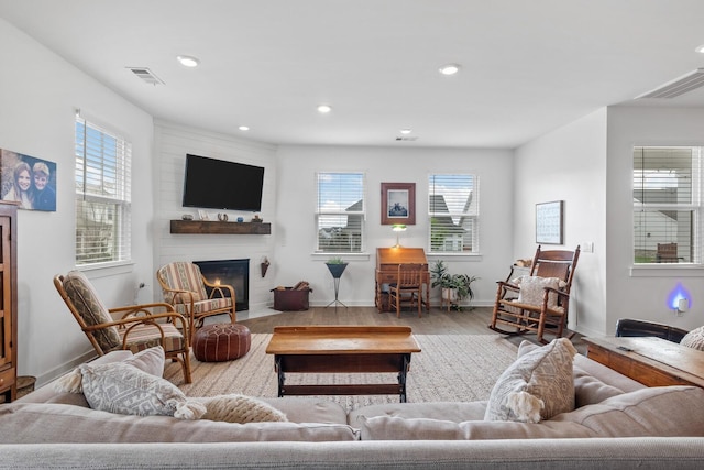 living room with plenty of natural light and light wood-type flooring