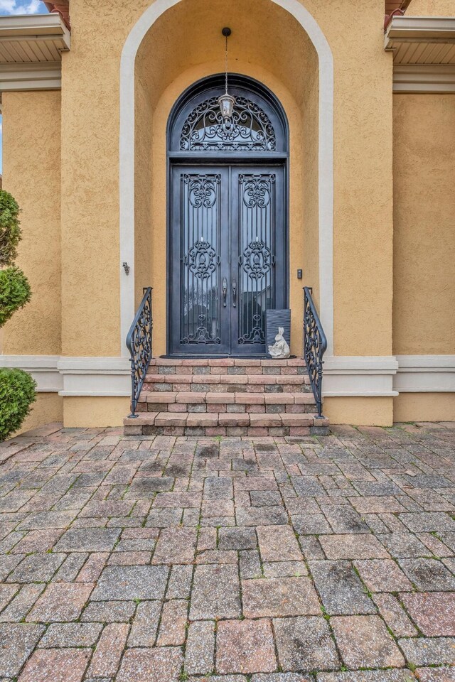 entrance to property featuring french doors