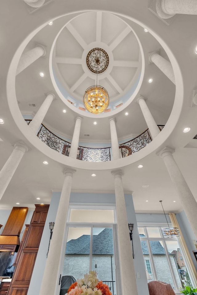 details with ornamental molding, ornate columns, and coffered ceiling