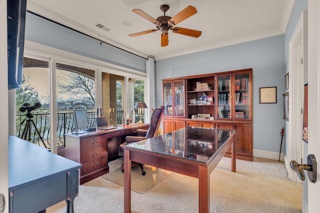 office featuring light carpet, crown molding, and ceiling fan