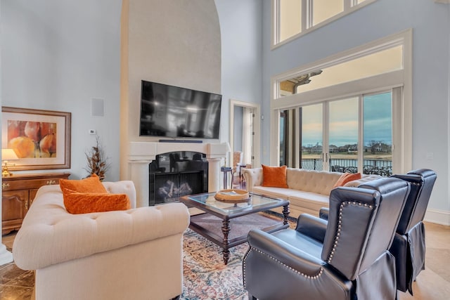 living room featuring plenty of natural light and a high ceiling