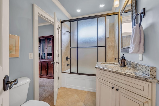 full bathroom featuring bath / shower combo with glass door, vanity, toilet, and tile patterned floors