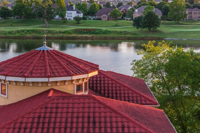 surrounding community featuring a water view