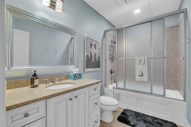 full bathroom with bath / shower combo with glass door, vanity, toilet, and tile patterned floors