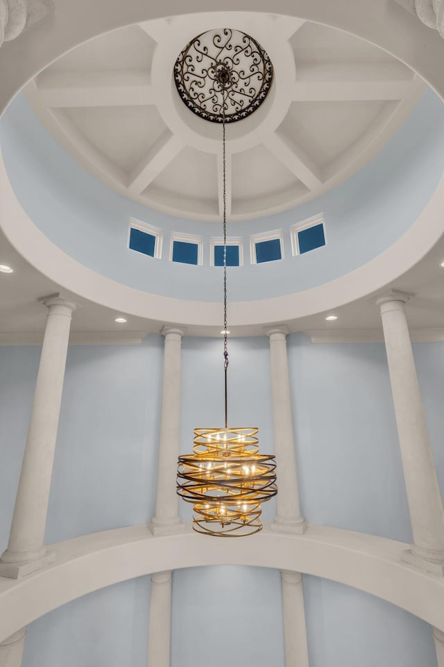 room details with coffered ceiling, beamed ceiling, and ornamental molding