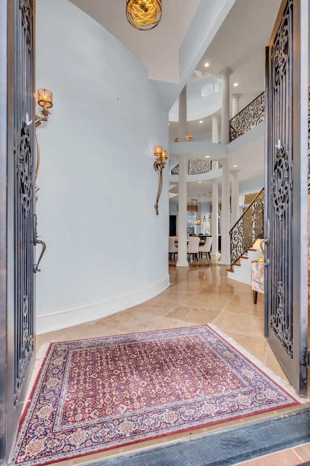 tiled entryway with ornate columns