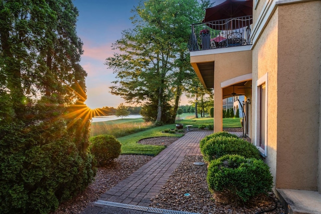 yard at dusk with a balcony