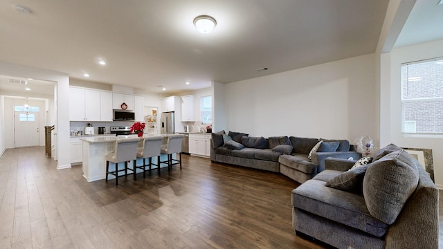 living room with dark wood-type flooring