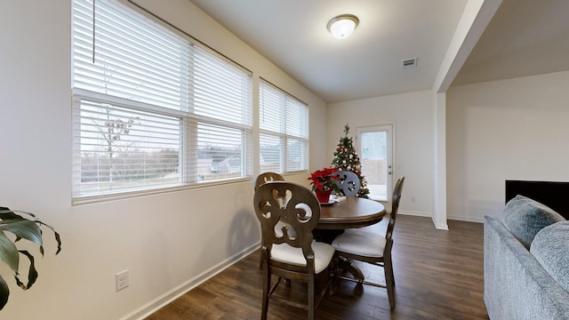 dining room with dark wood-type flooring