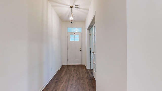 doorway with dark hardwood / wood-style floors