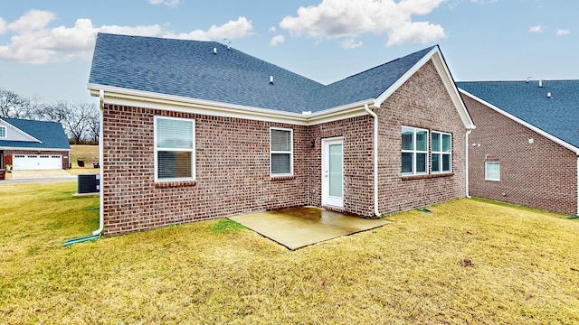 back of property featuring a yard, a patio, and central air condition unit