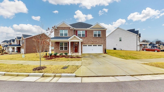 view of front of home featuring a garage and a front lawn