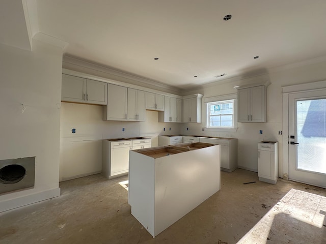 kitchen featuring a center island and ornamental molding