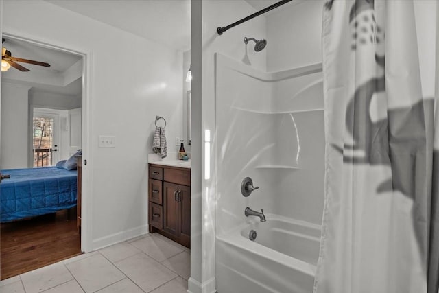 bathroom featuring hardwood / wood-style floors, vanity, ceiling fan, and shower / bath combo