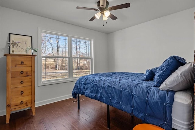 bedroom featuring ceiling fan and dark hardwood / wood-style floors