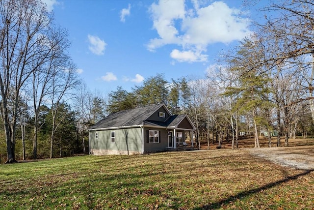 view of home's exterior with a yard