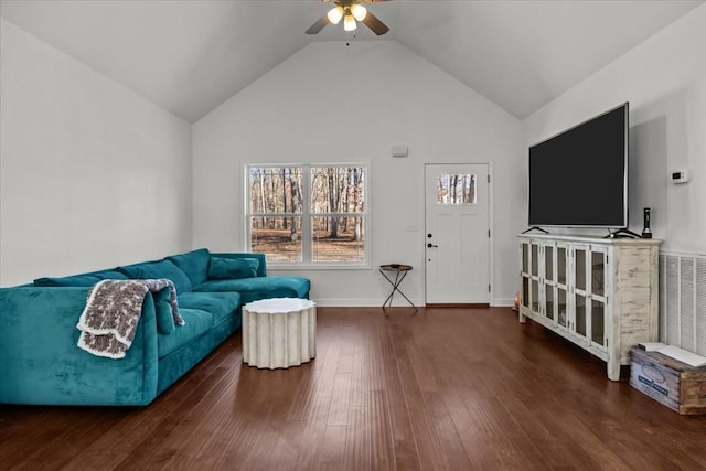 living room featuring dark hardwood / wood-style floors, ceiling fan, and high vaulted ceiling