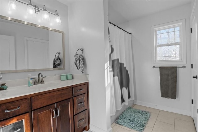 bathroom with tile patterned floors and vanity