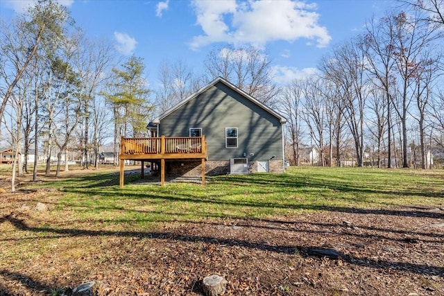 rear view of property with central AC unit, a deck, and a yard