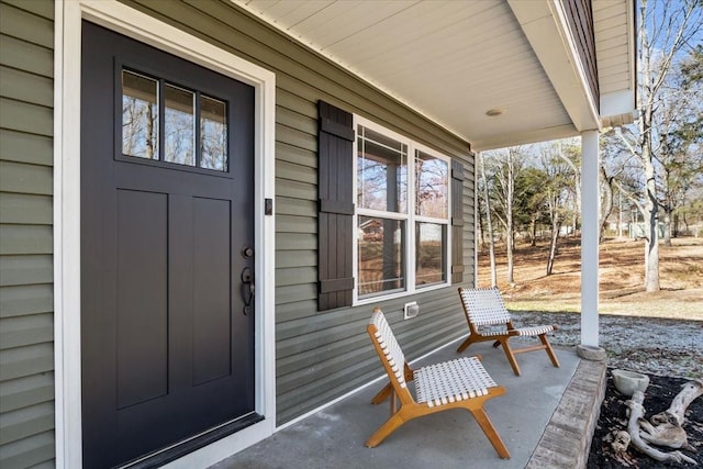 doorway to property with a porch