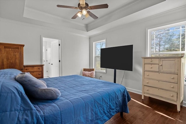 bedroom featuring crown molding, multiple windows, dark wood-type flooring, and ceiling fan