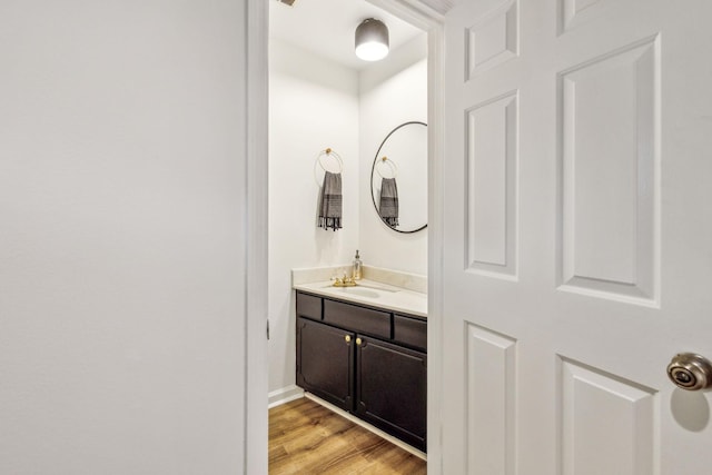 bathroom featuring hardwood / wood-style floors and vanity