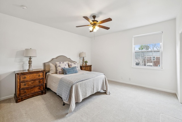 bedroom with light colored carpet and ceiling fan