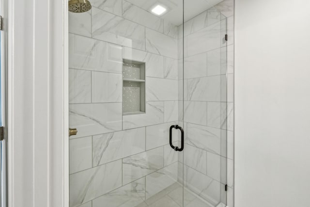 bathroom featuring an enclosed shower