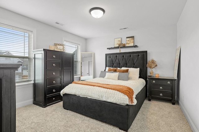 bedroom featuring light carpet