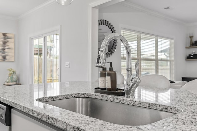 room details with crown molding, sink, dishwasher, and light stone countertops