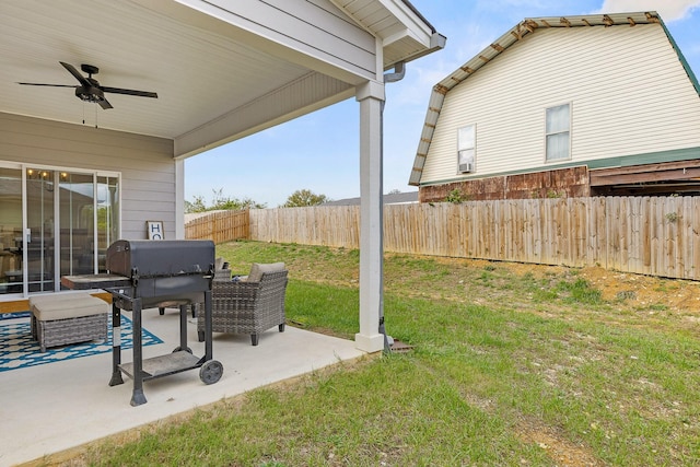 view of yard with ceiling fan and a patio