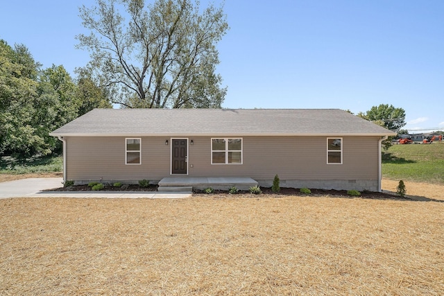 ranch-style house featuring a front yard