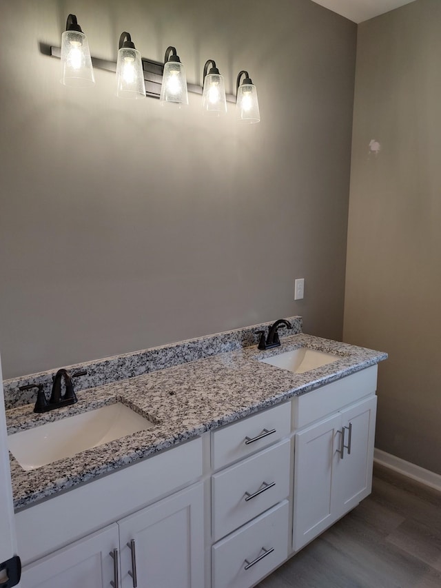 bathroom featuring hardwood / wood-style floors and vanity