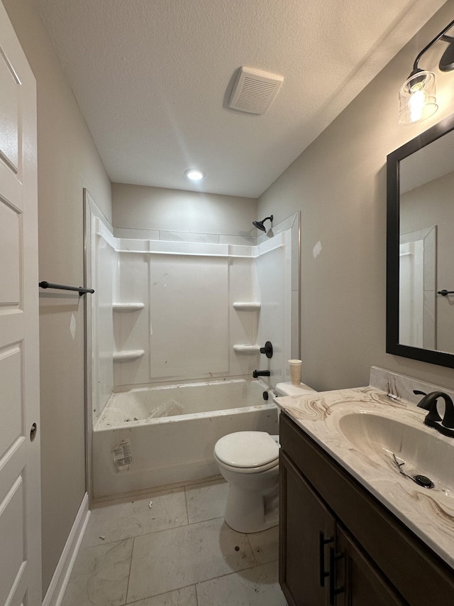 bathroom featuring visible vents, shower / washtub combination, toilet, vanity, and a textured ceiling