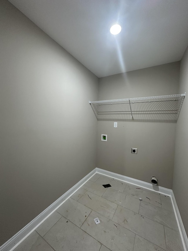 washroom featuring laundry area, hookup for an electric dryer, baseboards, and washer hookup