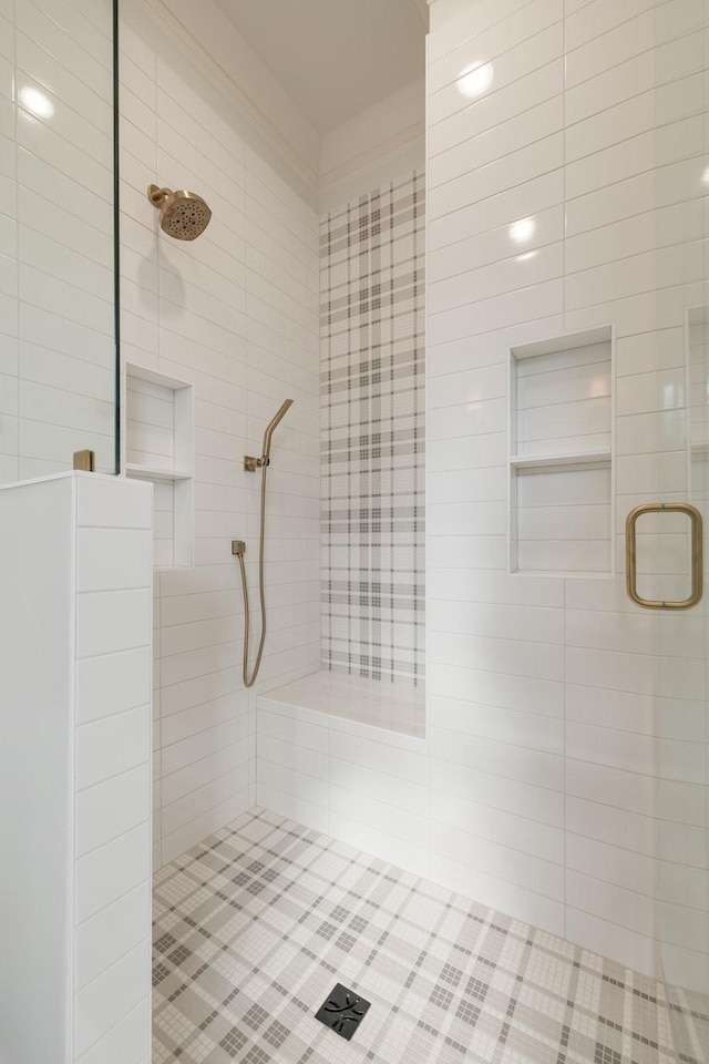 bathroom featuring a shower with shower door